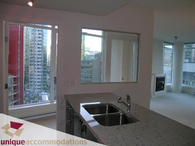 Bright kitchen with granite countertops and city view. - 1101 - 1188 West Pender, Vancouver Downtown