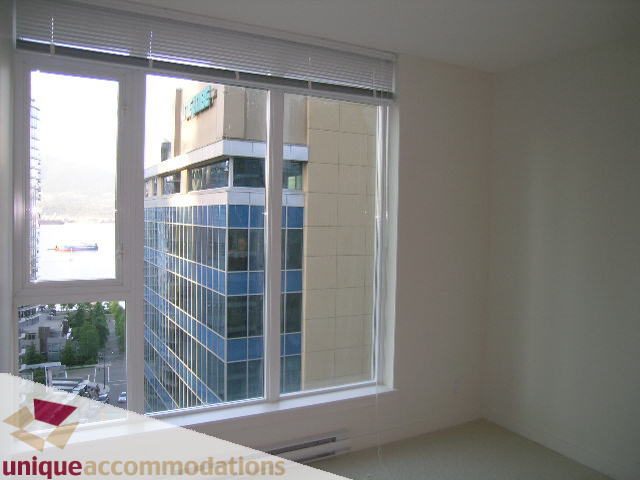 Bright living room with large windows and city view. - 1101 - 1188 West Pender, Vancouver Downtown