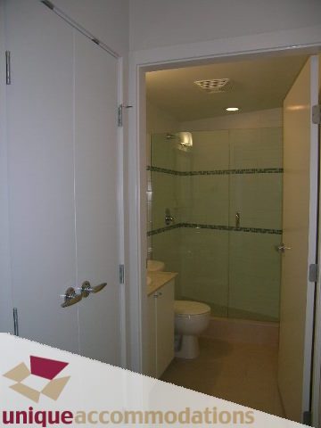 Furnished bathroom with glass shower and countertop sink. - 1101 - 1188 West Pender, Vancouver Downtown