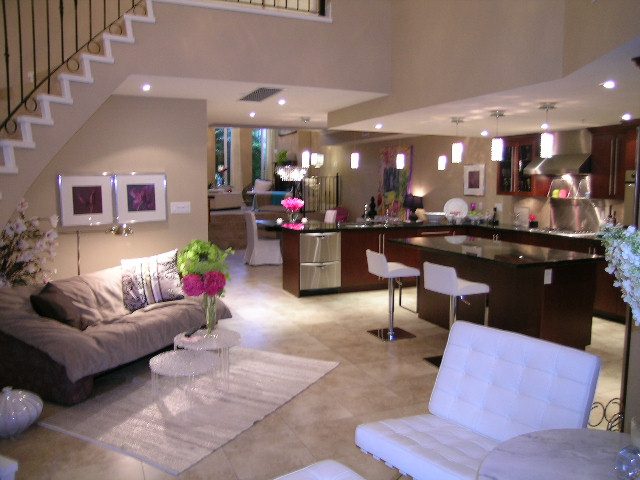 Modern living room with sleek furniture, large windows, and a view of the city. - 202 -1280 Richards Street, Vancouver Downtown