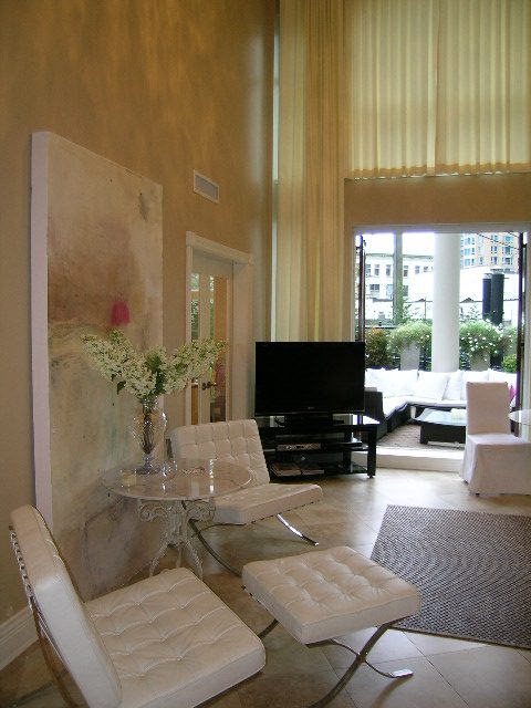 Bright living room with modern furniture, large window, and city view. - 202 -1280 Richards Street, Vancouver Downtown