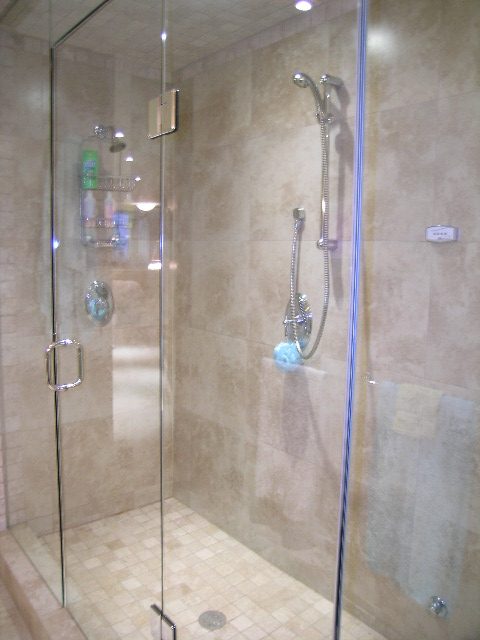 Bright shower with glass enclosure, modern fixtures, and beige tiles. - 202 -1280 Richards Street, Vancouver Downtown