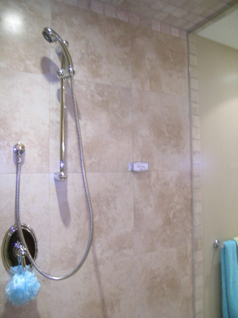 Bathroom with tiled walls and a handheld shower head. - 202 -1280 Richards Street, Vancouver Downtown
