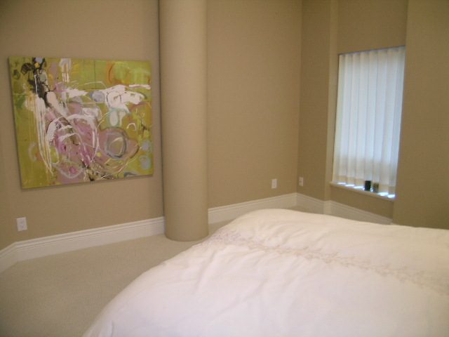 Bright bedroom with modern artwork and built-in lighting. - 202 -1280 Richards Street, Vancouver Downtown
