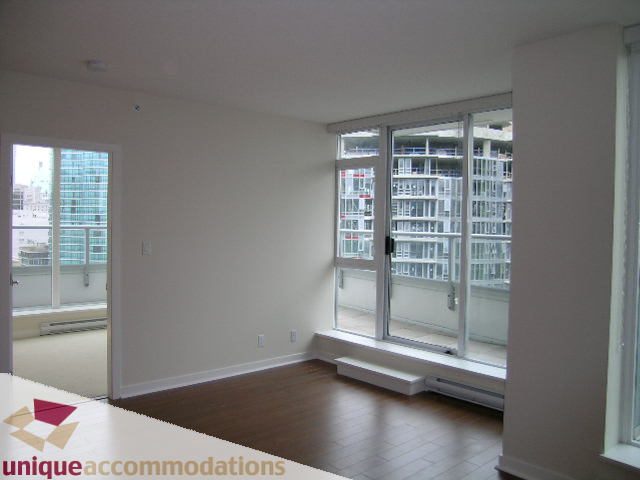 Bright living room with hardwood floors and city view. - 1802 - 821 Cambie Street, Vancouver Downtown