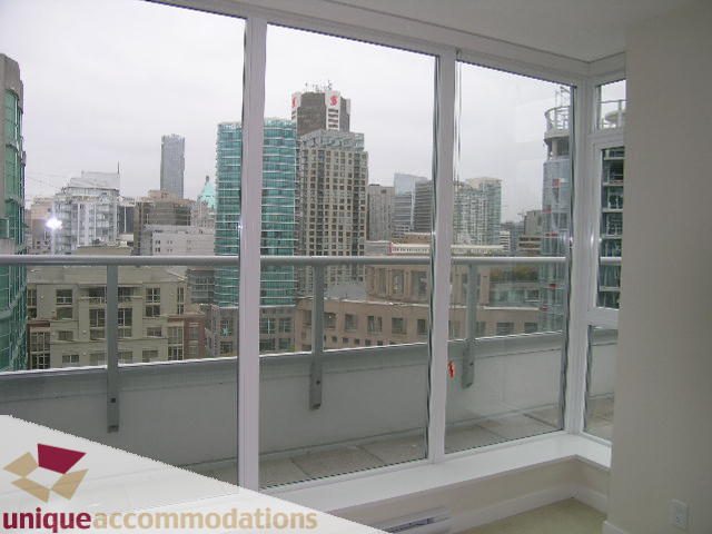Furnished balcony with city view and glass railings. - 1802 - 821 Cambie Street, Vancouver Downtown