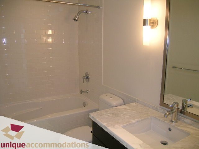 Bathroom with marble countertop and modern fixtures. - 1802 - 821 Cambie Street, Vancouver Downtown