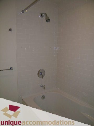 Bathroom with modern shower and bathtub setup. - 1802 - 821 Cambie Street, Vancouver Downtown