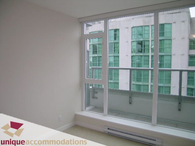 Bright living room with large windows offering a city view. - 1802 - 821 Cambie Street, Vancouver Downtown