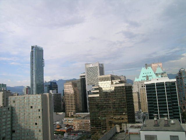 Furnished 1-bedroom + den with stunning city view, featuring modern furnishings and a cozy den area. - 2217 - 938 Smithe Street, Vancouver Downtown