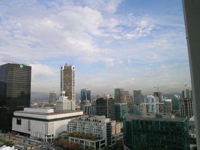 Spacious 1-bedroom + den condo with stunning city view, featuring modern furnishings and large windows. - 2217 - 938 Smithe Street, Vancouver Downtown