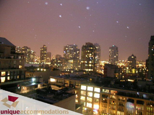 Furnished 2-bedroom + den with stunning city view at dusk. - 1501 - 1280 Richards Street, Vancouver Downtown