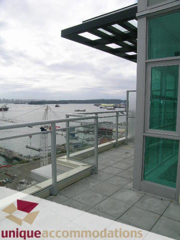 Furnished penthouse with a stunning city view and modern balcony. - 2301 - 188 E Esplanade, North Vancouver