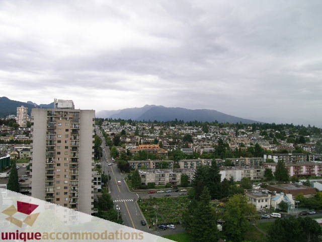 Furnished penthouse with a stunning city view and mountain backdrop. - 2301 - 188 E Esplanade, North Vancouver