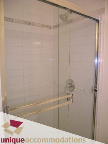 Bright bathroom with glass shower and towel bar. - 2301 - 188 E Esplanade, North Vancouver