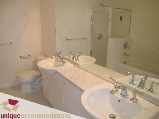 Bright bathroom with white countertops and modern fixtures. - 2301 - 188 E Esplanade, North Vancouver