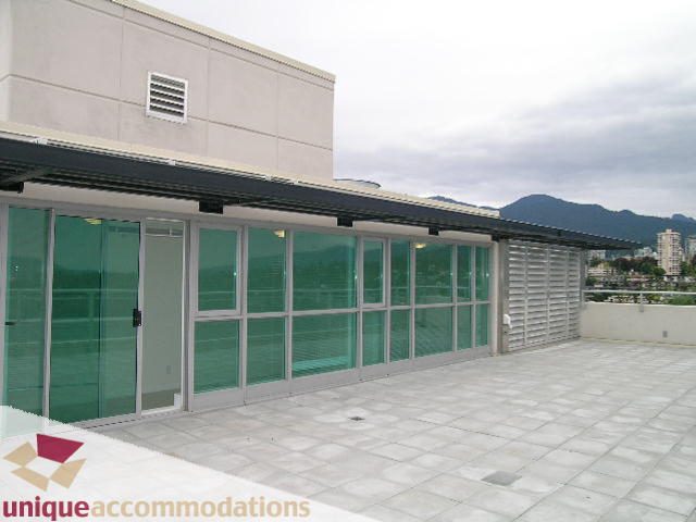 Bright penthouse with expansive city view and modern glass walls. - 2301 - 188 E Esplanade, North Vancouver