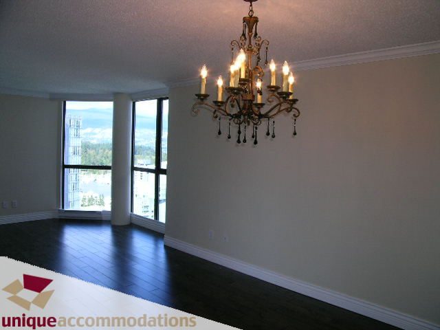 Bright living room with hardwood floors, large windows, and a chandelier. - 2201 - 1415 West Georgia, Vancouver Downtown