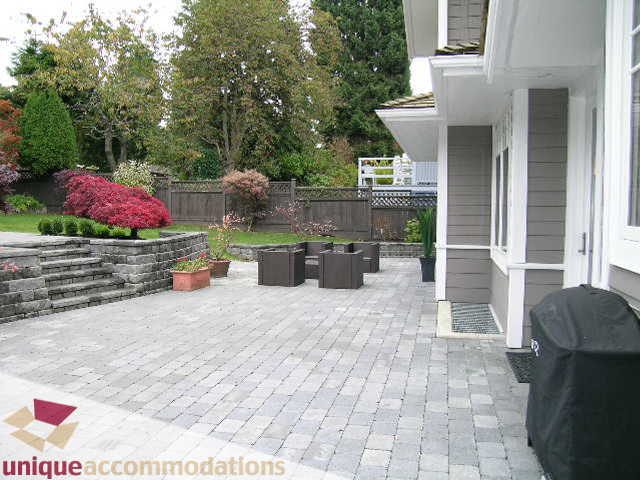 Furnished patio with paver stones and landscaped garden. - 1365 Kings Ave, West Vancouver