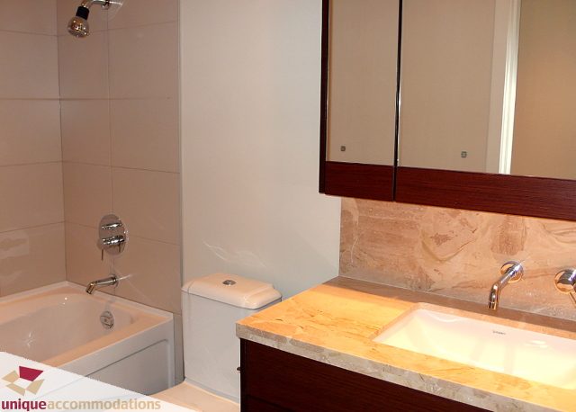 Bright bathroom with marble countertops and modern fixtures. - 2802 - 1277 Melville Street, Vancouver Downtown