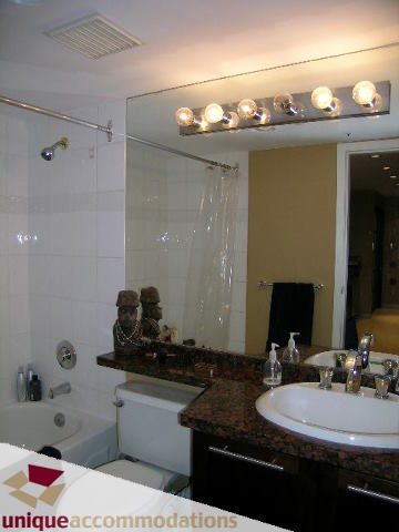 Bathroom with granite countertops and a modern vanity setup. - 2803 - 930 Cambie Street, Vancouver Downtown