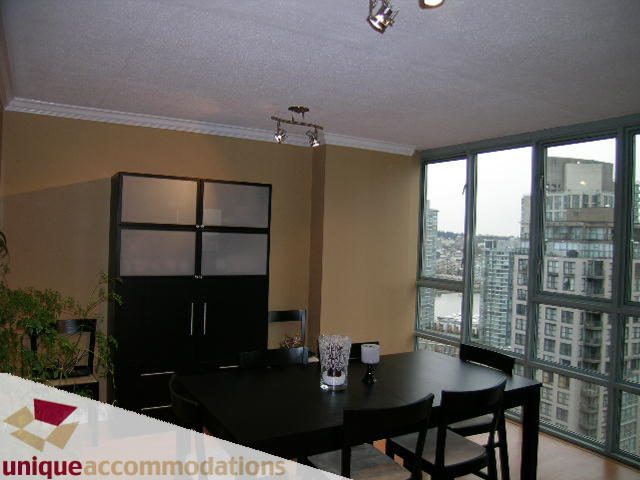 Furnished dining area with city view and modern decor. - 2803 - 930 Cambie Street, Vancouver Downtown
