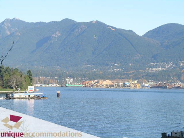 Bright living room with stunning city view and waterfront access. - 104 - 1139 West Cordova Street, Vancouver Downtown