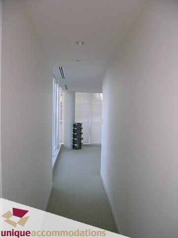 Bright hallway with neutral walls and carpeted floors. - 104 - 1139 West Cordova Street, Vancouver Downtown
