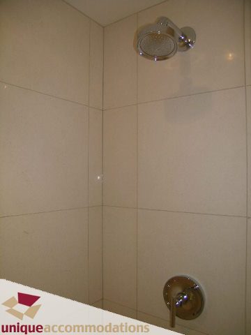 Bright shower with modern fixtures and white tiles. - 104 - 1139 West Cordova Street, Vancouver Downtown