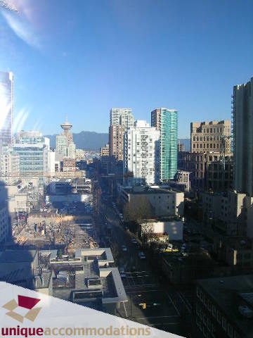 Bright living room with city view and modern furnishings. - 1806 - 969 Richards Street, Vancouver Downtown