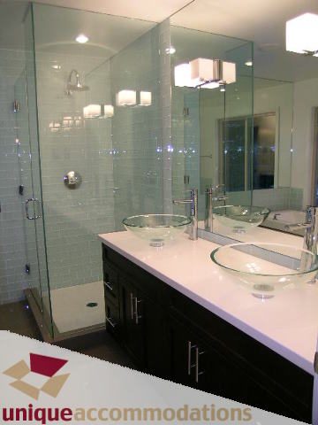 Modern bathroom with glass shower and white countertops. - 811 Huntingdon Crescent, North Vancouver