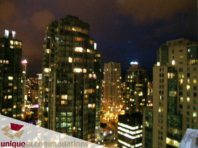 Furnished 2-bedroom condo with stunning city view at night. - 2701 - 1211 Melville Street, Vancouver Downtown