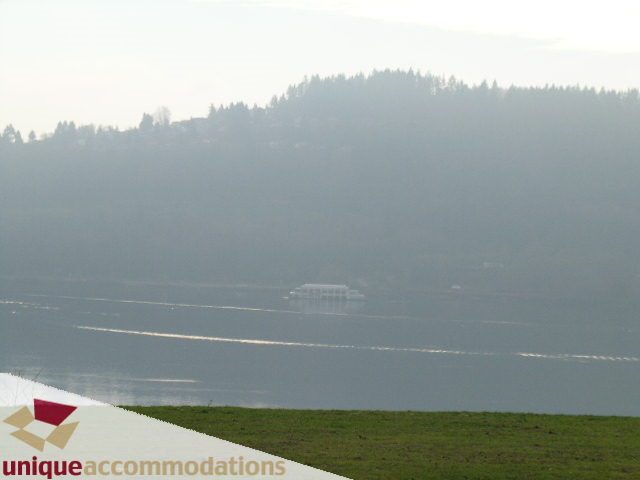Furnished 2-bedroom + den condo with a serene view of the water and forested hills. - 109 - 530 Raven Woods seasons south, North Vancouver