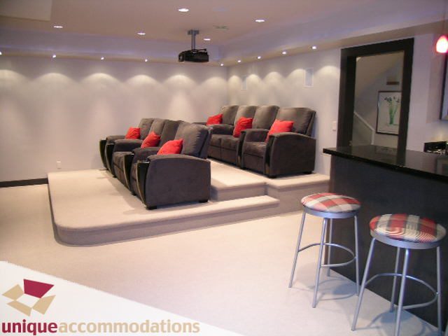 Modern home theater with plush seating and bar stools. - 2429 West 19th Avenue, Vancouver West Side
