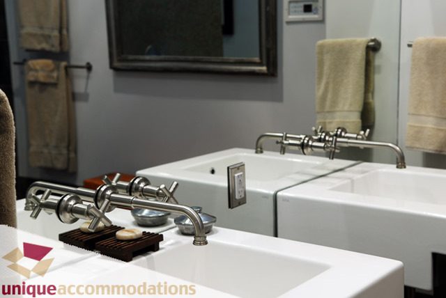 Modern bathroom with white countertops and chrome fixtures. - 1178 West 7th Avenue, Vancouver West Side