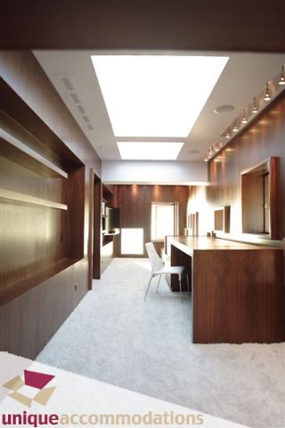 Bright kitchen with wooden cabinets and a skylight, modern design. - 2601 - 1000 Beach Avenue, Vancouver Downtown