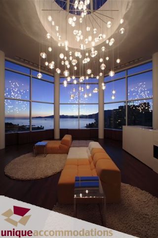 Furnished living room with modern furniture, large windows, and a stunning city view. - 2601 - 1000 Beach Avenue, Vancouver Downtown