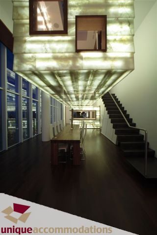 Furnished living room with hardwood floors, city view, and modern lighting. - 2601 - 1000 Beach Avenue, Vancouver Downtown