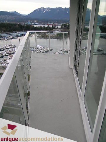 Spacious balcony with stunning city view and modern furnishings. - 2401-1277 Melville, Vancouver Downtown