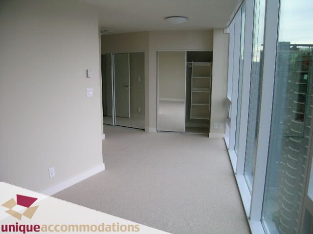 Spacious 2-bedroom + den condo with large windows offering city views and ample closet space. - 2401-1277 Melville, Vancouver Downtown