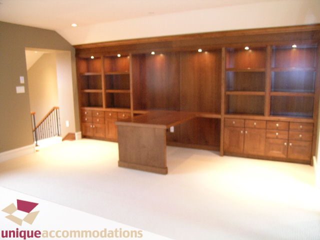 Furnished home office with built-in shelving and desk, hardwood floors. - 2550 Marr Creek Ct, West Vancouver