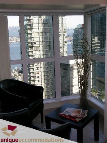 Bright living room with city view and modern furnishings. - 2005 - 1238 Melville, Vancouver Downtown
