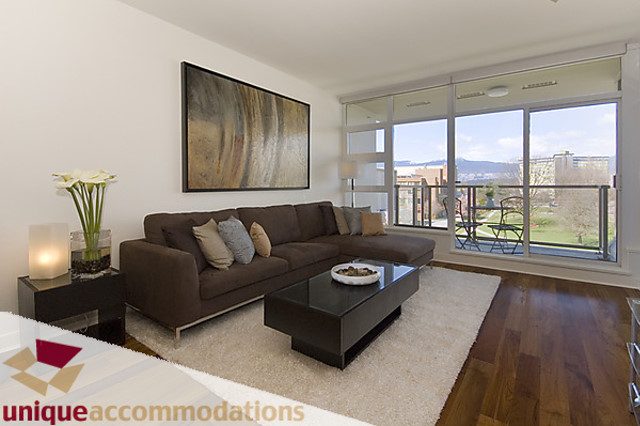 Furnished living room with a city view and modern decor. - 505 - 1808 West 1st Avenue, Vancouver West Side