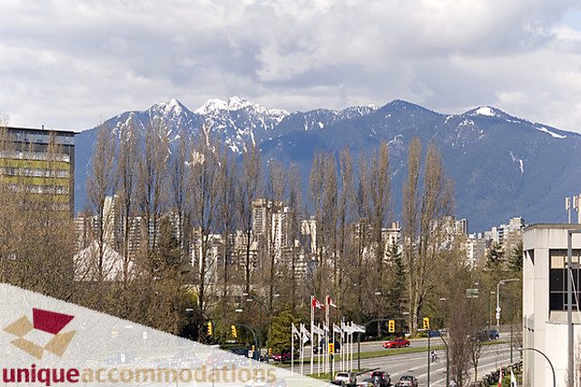 Furnished 1-bedroom + den with city view and mountain backdrop. - 505 - 1808 West 1st Avenue, Vancouver West Side