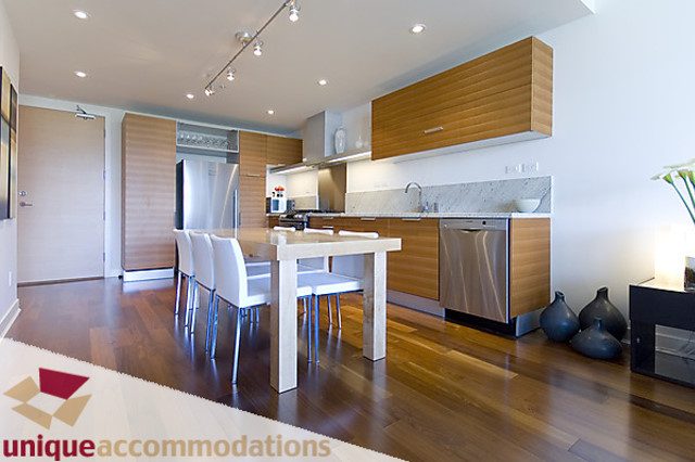 Bright kitchen with modern appliances, hardwood floors, and a clean, open design. - 505 - 1808 West 1st Avenue, Vancouver West Side