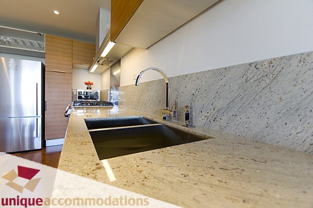 Bright kitchen with granite countertops and modern stainless steel appliances. - 505 - 1808 West 1st Avenue, Vancouver West Side