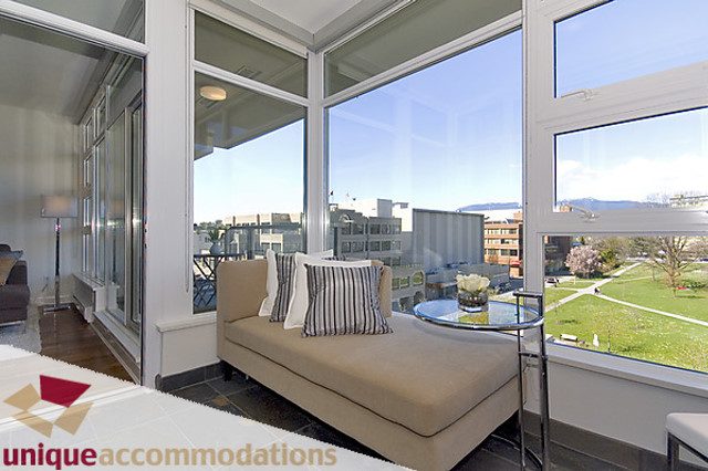 Furnished living room with hardwood floors, city view, and large windows. - 505 - 1808 West 1st Avenue, Vancouver West Side