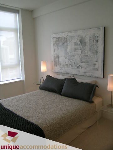 Spacious bedroom with modern artwork and cozy bedding. - 307- 1808 West 1st Avenue, Vancouver West Side