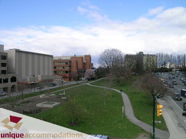 Furnished living room with city view and green space. - 307- 1808 West 1st Avenue, Vancouver West Side
