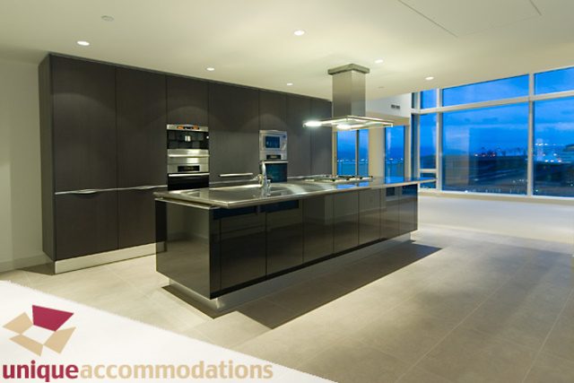 Modern kitchen with sleek countertops and city view. - 903 - 1139 West Cordova Street, Vancouver Downtown